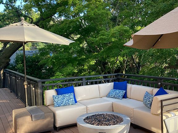 Outdoor Deck off of kitchen and living room with heritage oak tree and Japanese maple trees, gas line for Firepit and BBQ