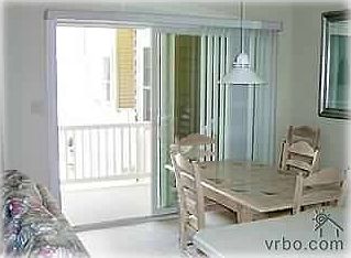 Dining area with nearby balcony.