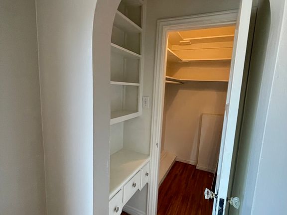 Bedrooms have Walk in closets, including this arched entry in bedroom 1
