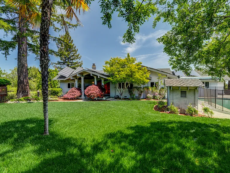 This tranquil home is located at the end of a cul-de-sac featuring a sparkling pool at the front and a wonderful rear upper deck beckoning for entertainment or relaxation, offering a spectacular view of the bay.