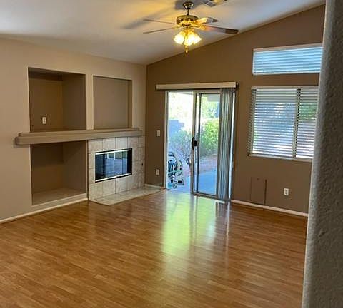 Great room with fireplace, hardwood floors, and eating area