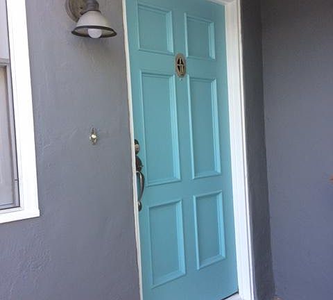 Let this bright and cheery turquoise door welcome you home.