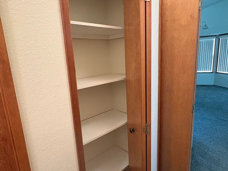 Linen closet in hallway.