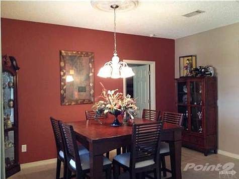 Formal dining room with tile flooring