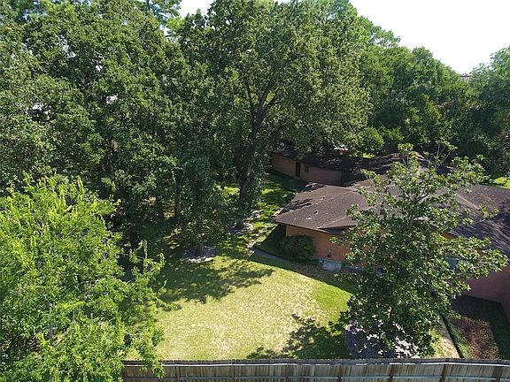 Wooded 1/2 + acre ravine lot in the heart of Hedwig Village