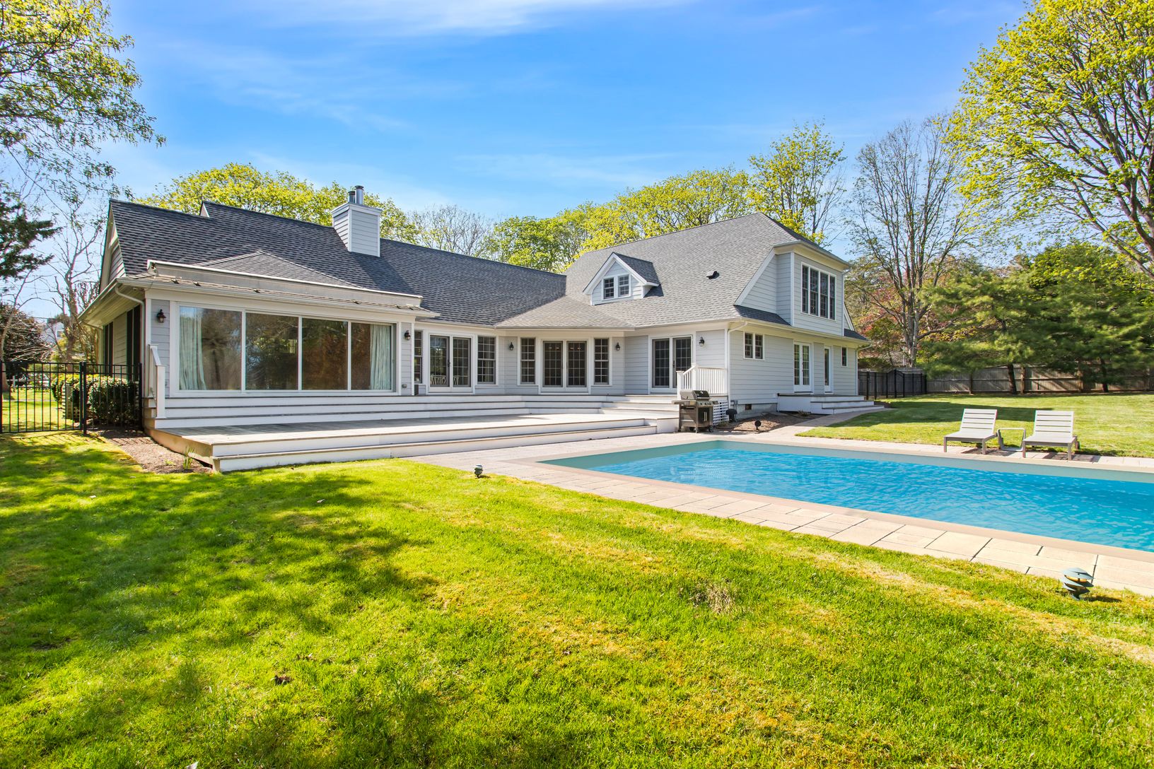  Beautifully  landscaped Backyard with Heated Pool and plenty of ball-room