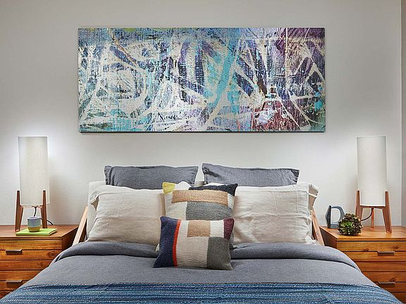 Spacious apartment bedroom with plush carpet flooring.