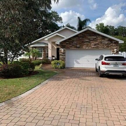 Garage with paver drive.