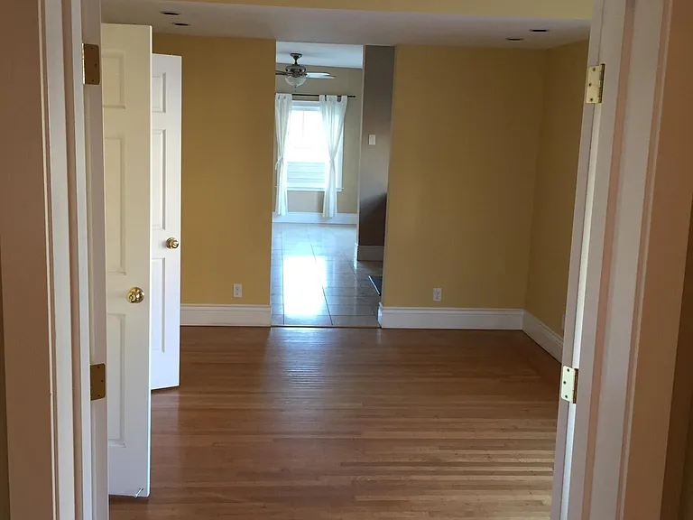 View from living room to family room thru dining room