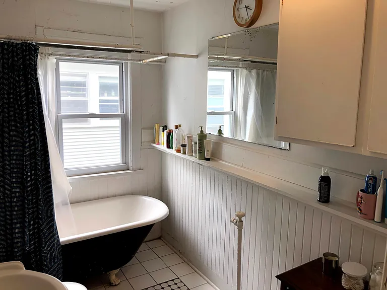 Full bathroom with clawfoot tub
