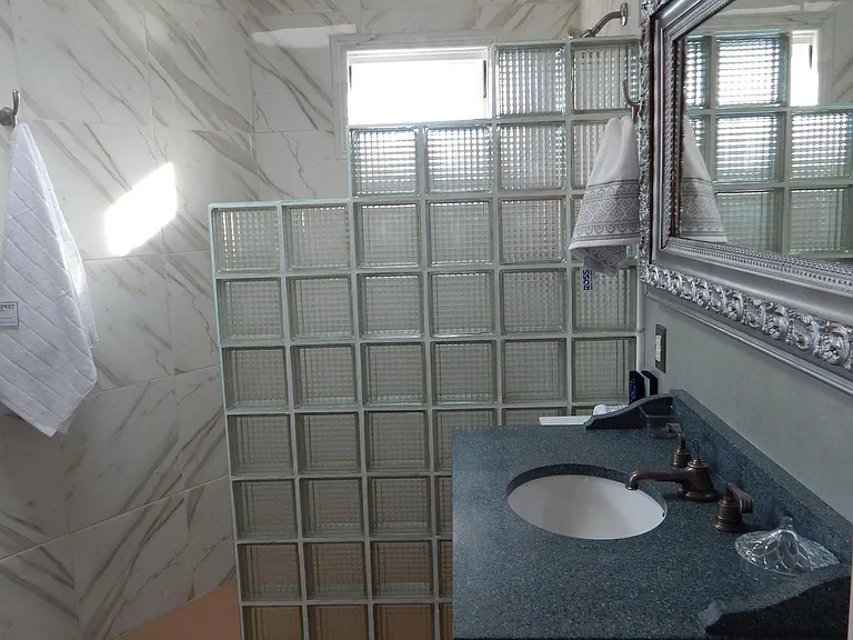 Bright Bathroom
Marble shower stall, antique marble sink