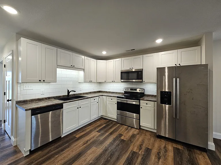 Kitchen with tile backsplash and countertop lighting
*May be a photo of a similar unit