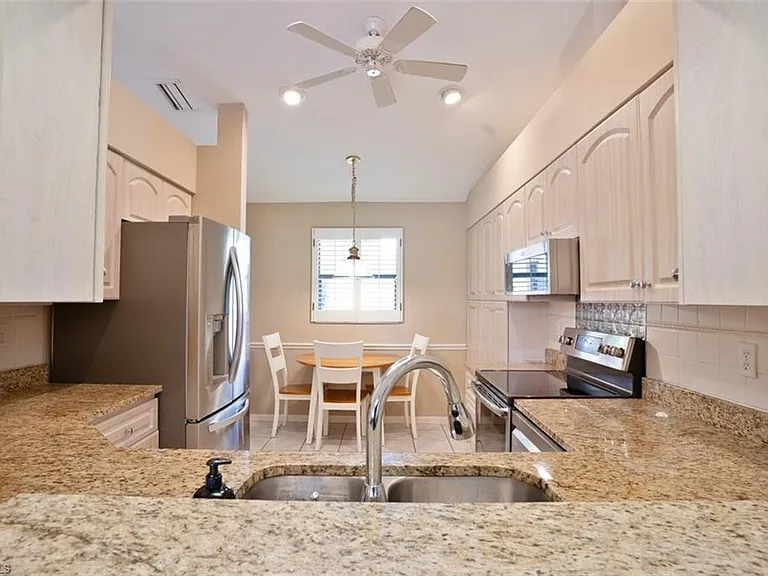 Gorgeous granite kitchen counters & stainless appliances.