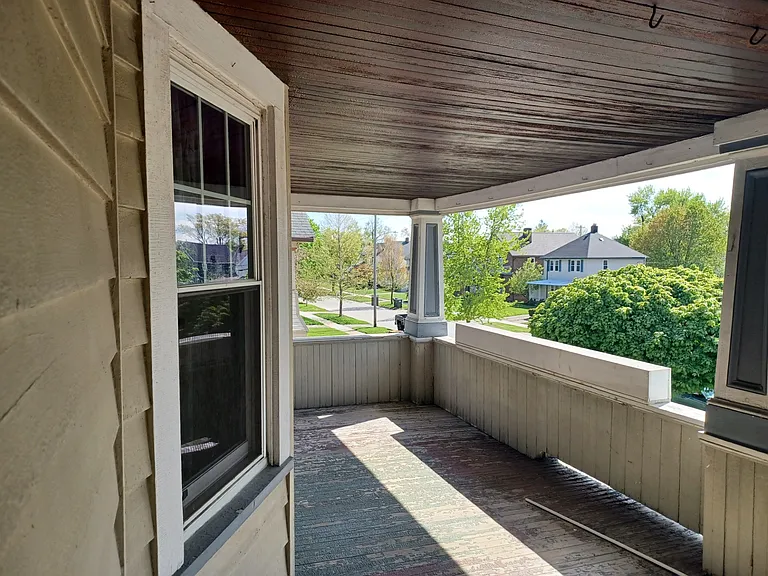 Front porch with garden boxes for tenant use.