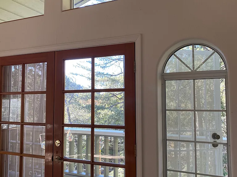 Primary Bedroom on the top floor balcony doors.