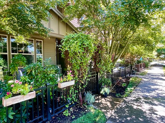 Front of house, accessible via tree-lined sidewalk.