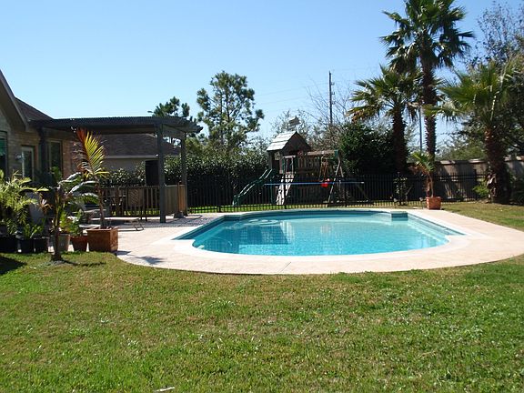 huge yard with pool and playground
