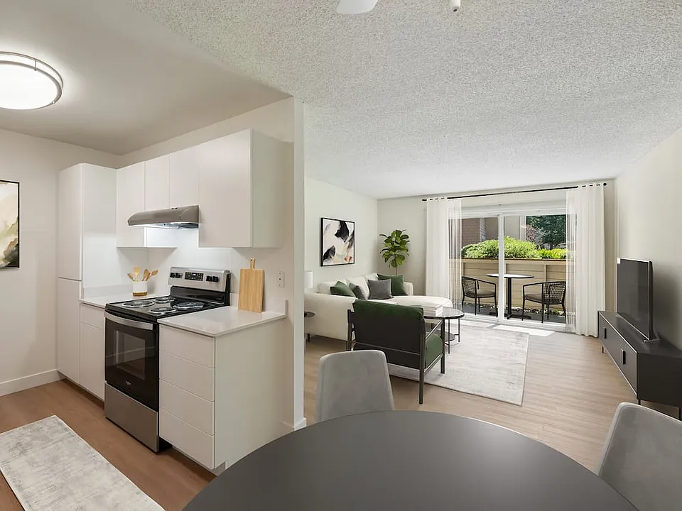 Renovated Package II kitchen, dining, and living room with hard surface flooring