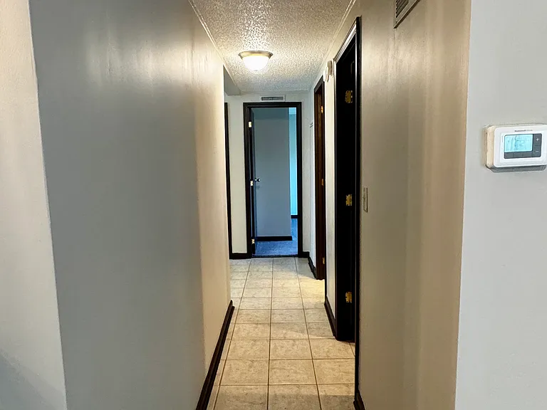 Main Hallway from grate room to bedrooms, main bathroom, and laundry room