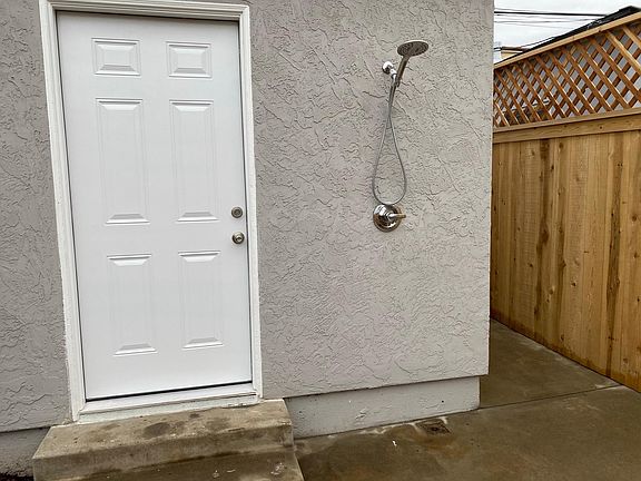 Wash off the sand after surfing at the beach with this outdoor shower (hot and cold water)
