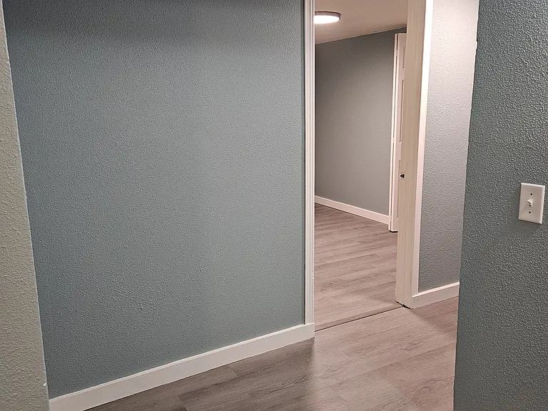 Into second hallway, towards bedroom 2 and 3.