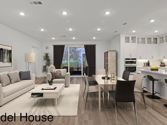 large living room with dining area - model home photo