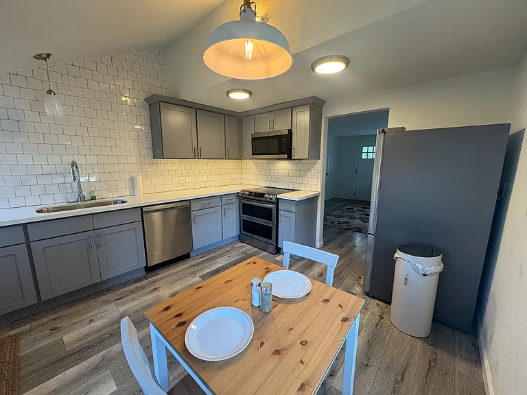 Recently updated kitchen has a convection stove, double ovens, microwave, dishwasher, and full size fridge/freezer.