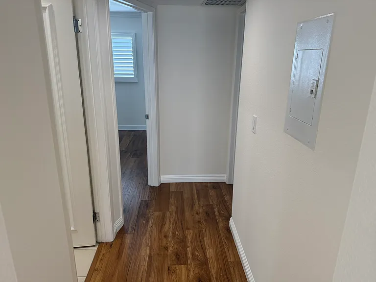 Hallway to rooms and bathrooms
