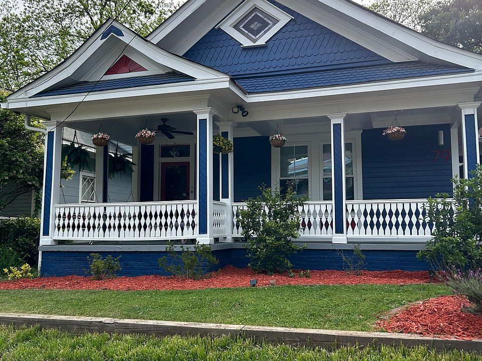 Charming curb appeal! Landscaped yard & inviting front porch with side-by-side swings.