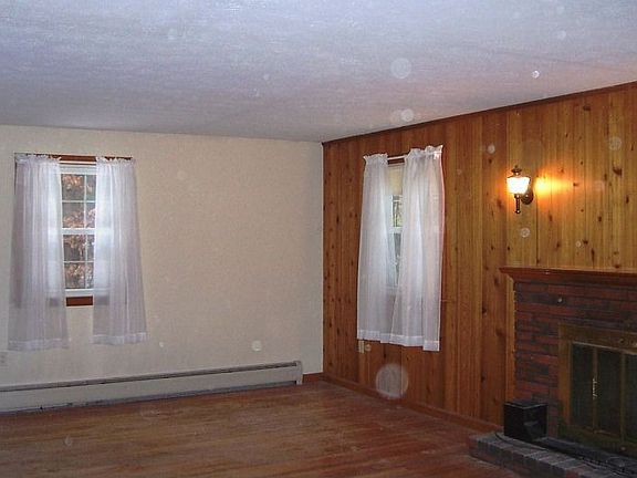 Hardwood throughout Living with Cozy Fireplace