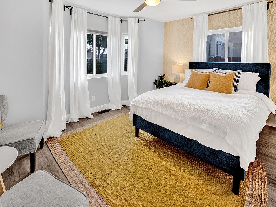 Bedroom 1 with Queen size bed and sitting area.