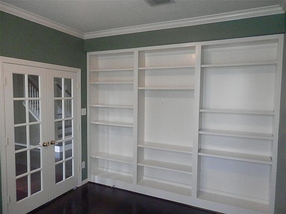 Study downstairs to the right of the entry with the french doors and built-ins shelves