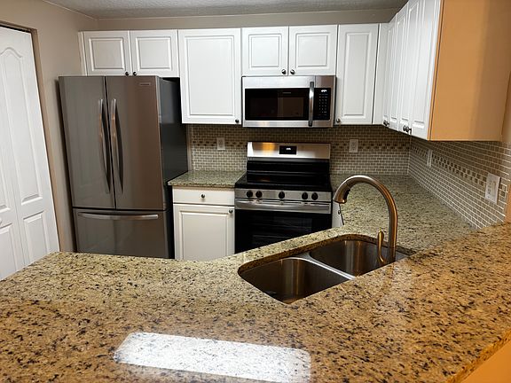 Granite Countertops and Ceramic Tile Backsplash!