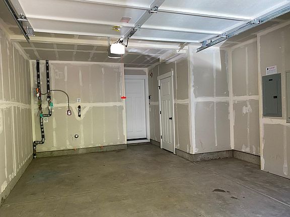 Single garage with a walk-in storage room at the right.