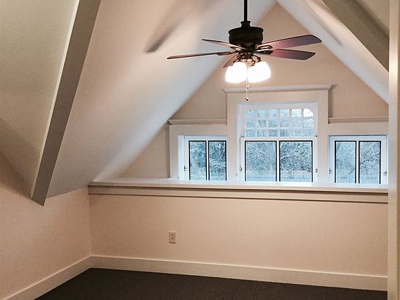 Bedroom with cathedral ceiling & skylight