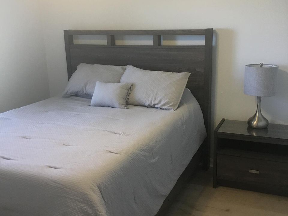 Bedroom 1. Queen size bed, side table, closet and dresser in closet
