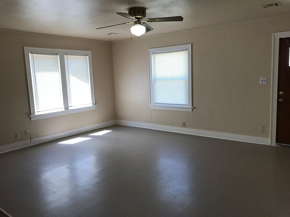 Living room with front door on right side