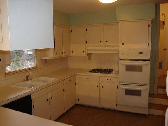 double oven and dishwasher in kitchen