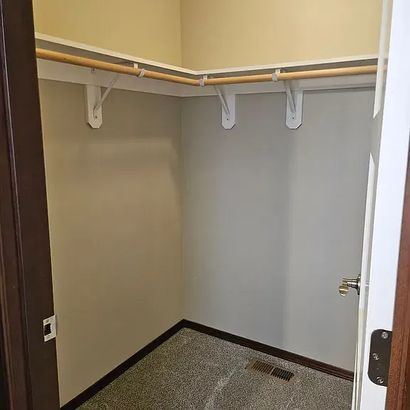 Primary bedroom walk-in closet.