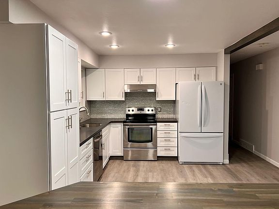 View entering from garage door into main stairwell landing.