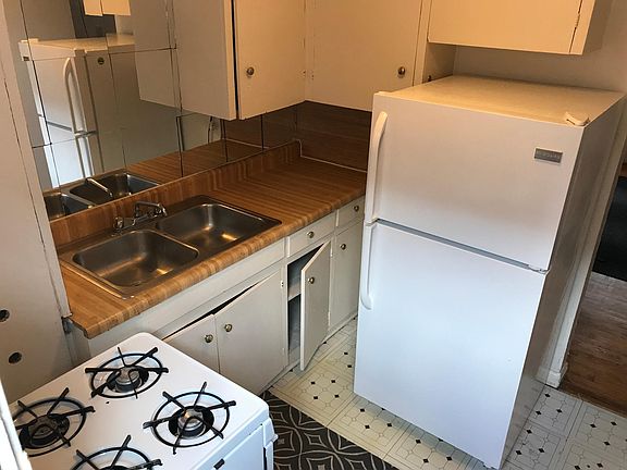 Kitchen, refrigerator, oven range, walk-in pantry and a back door, too.