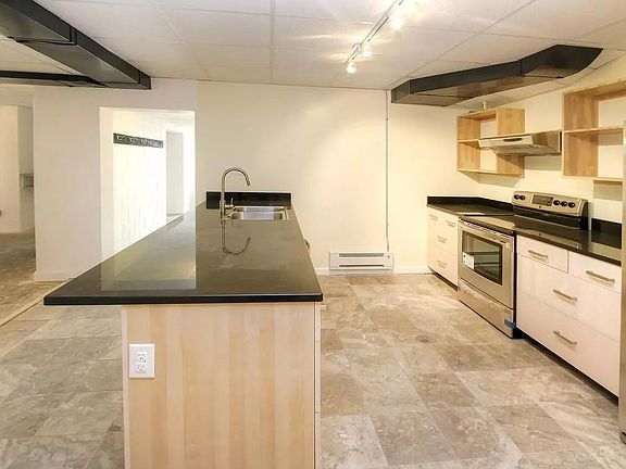 The kitchen is huge and fully renovated and will come stocked with all cookware and dish ware to make a standard meal