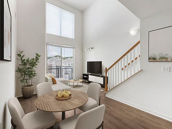 Renovated Package I dining and living room with hard surface flooring