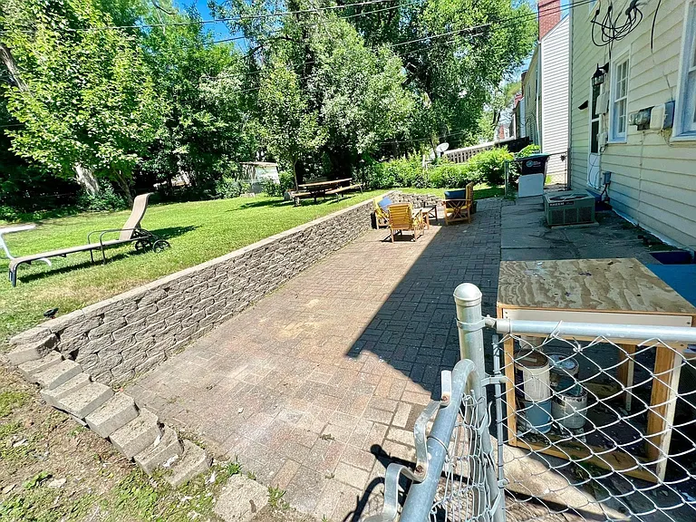 Large patio and big, fenced backyard