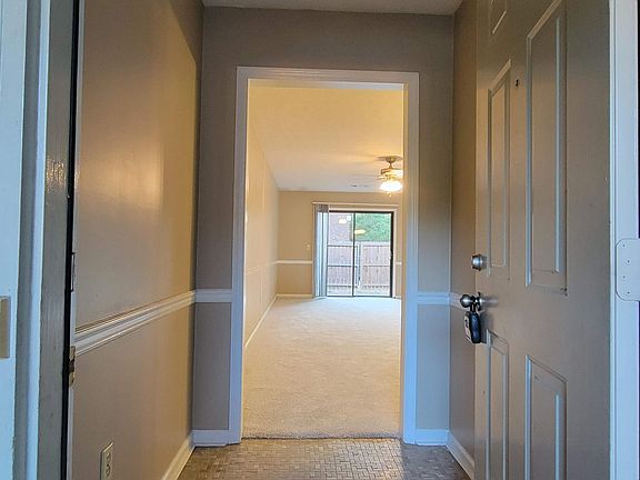 Looking in front door through foyer into the living room