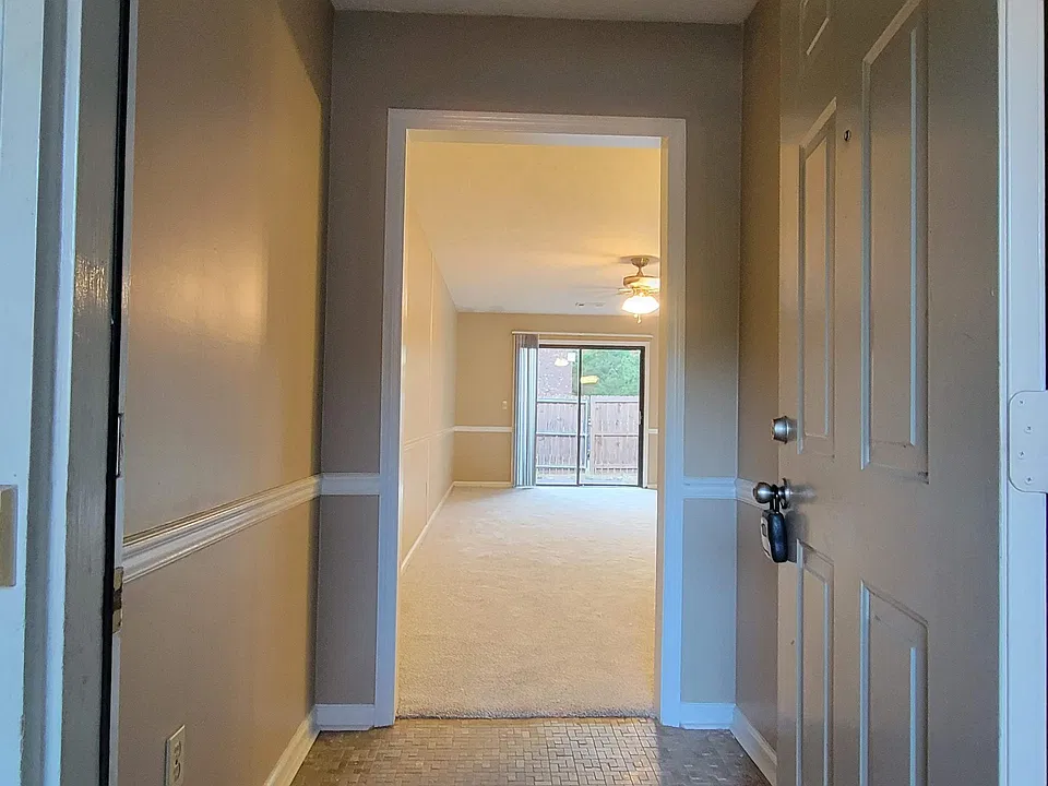 Looking in front door through foyer into the living room