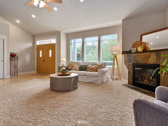 The ceramic tile entry has french doors and opens up to a light filled living room.