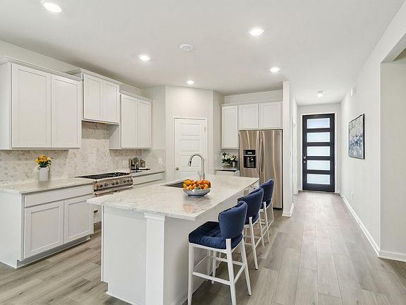 Virtually staged kitchen in the Matador floorplan at a Meritage Homes community.