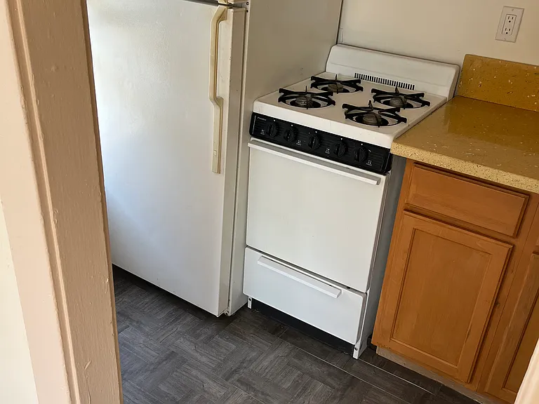 Kitchen with refrigerator and stove