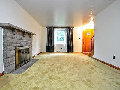Family room with stone masonry fireplace